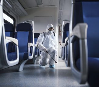 man-white-protection-suit-disinfecting-sanitizing-subway-train-interior-stop-spreading-highly-contagious-corona-virus-scaled